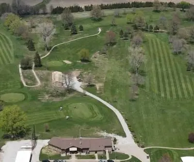 Panoramic aerial of ponds, striped fairways and the clubhouse at Falls City Golf Course in Falls City, Nebraska