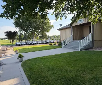 Clubhouse entrance steps and a row of parked golf carts at Southern Hills Golf Club in Hastings, Nebraska