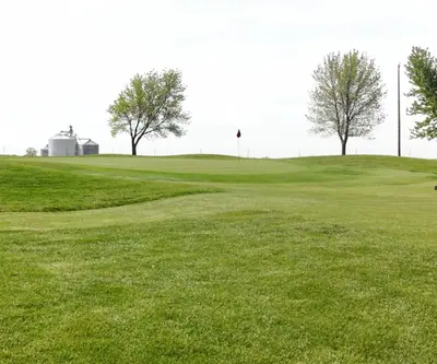 A green set against the grain bins at Club 91 Golf Course in Leigh, Nebraska.