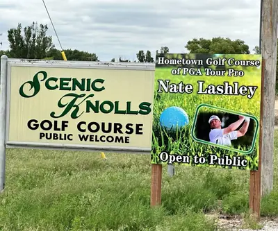 Scenic Knolls Golf Course sign beside a sign naming it PGA Tour pro Nate Lashley's hometown course, Mitchell, Nebraska