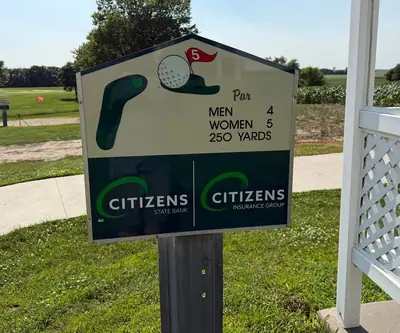 Hole 5 sign listing par and 250 yards near the cart path at Shell Creek Valley Golf Course in Newman Grove, Nebraska