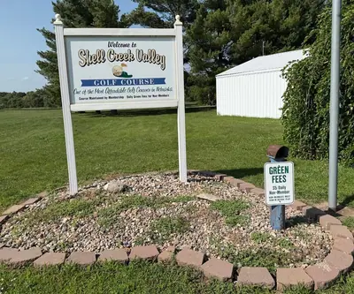 Welcome sign and green fees box at Shell Creek Valley Golf Course in Newman Grove, Nebraska
